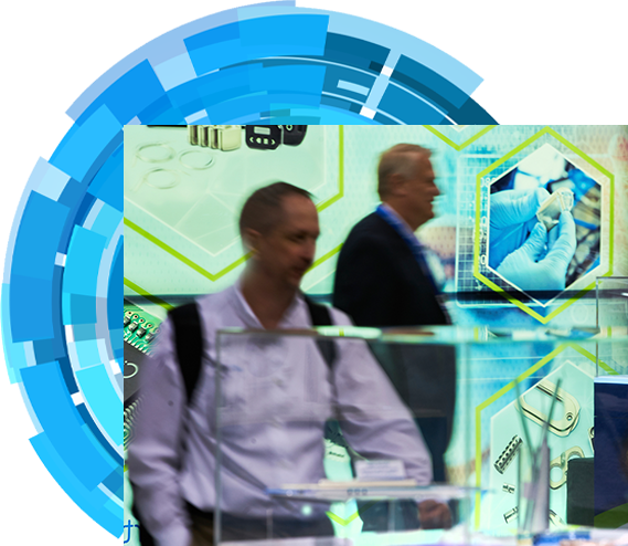 Two attendees examining products in the expo hall floor