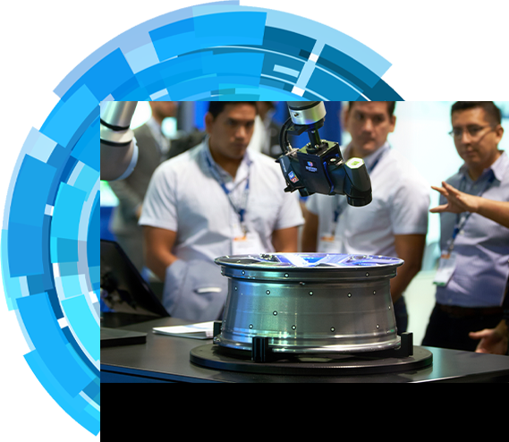 An exhibitor introducing a robot to three show attendees